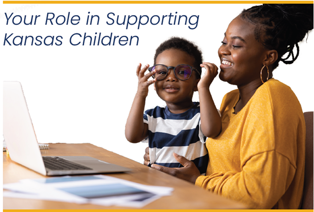 Child setting on females lap viewing a computer, text your role is supporting kansas children